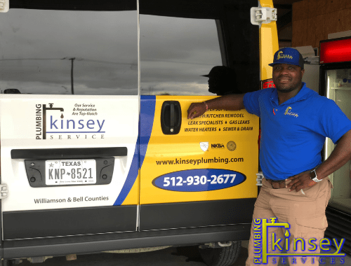 Kinsey Plumbers in front of company turck.