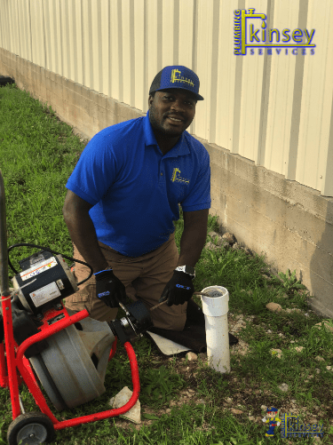 A man working on a clogged sewer line in Round Rock, TX